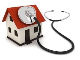 Stethoscope on roof of miniature house model