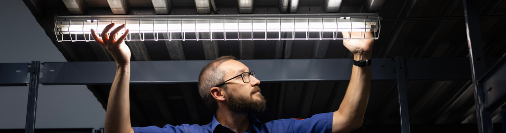 ALT TEXT - A 4 Star Electric electrician carefully installs new lighting fixtures