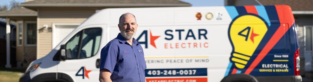 4 Star electrician standing in front of a van