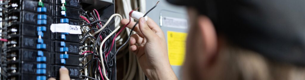 Close up shot of a 4 Star technician working on an Electrical Panel