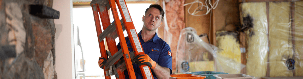A 4-Star Electrician moves his ladder to his desired location to carefully install a new detector.