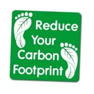"Reduce your carbon footprint" sign with leaf-shaped footprints