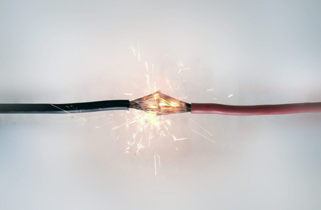 Short circuit of electrical wires creating spark