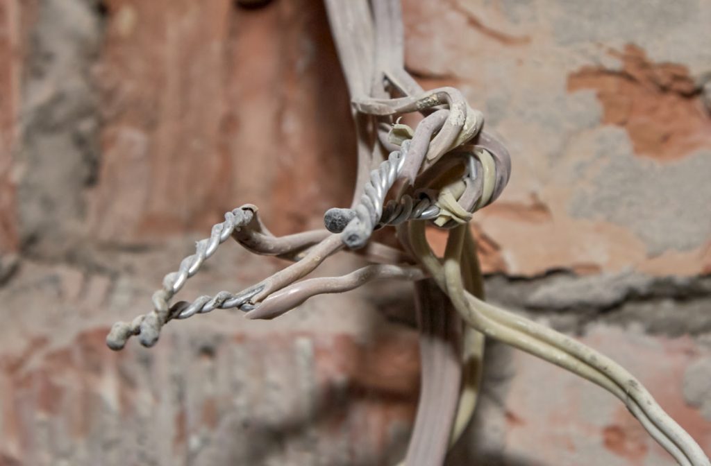 Old electrical aluminum wires connected by twisting