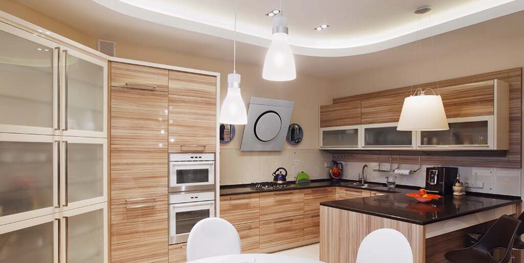 Modern kitchen with magnetic low-voltage lighting.