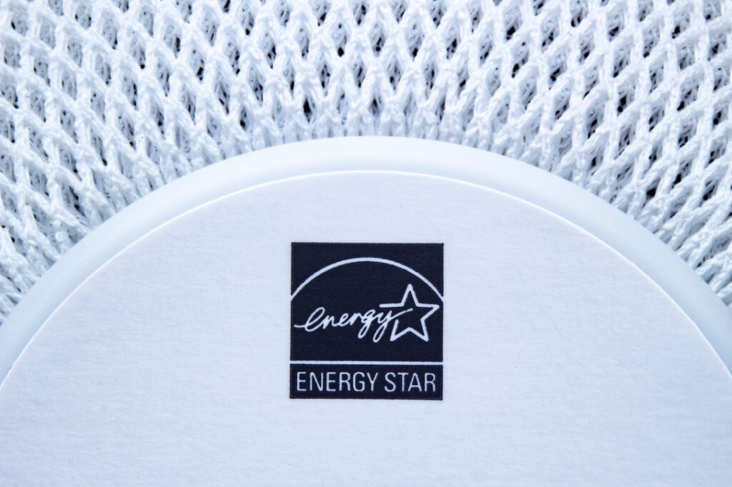 An Energy Star stamp on an Apple White Homepod Mini.