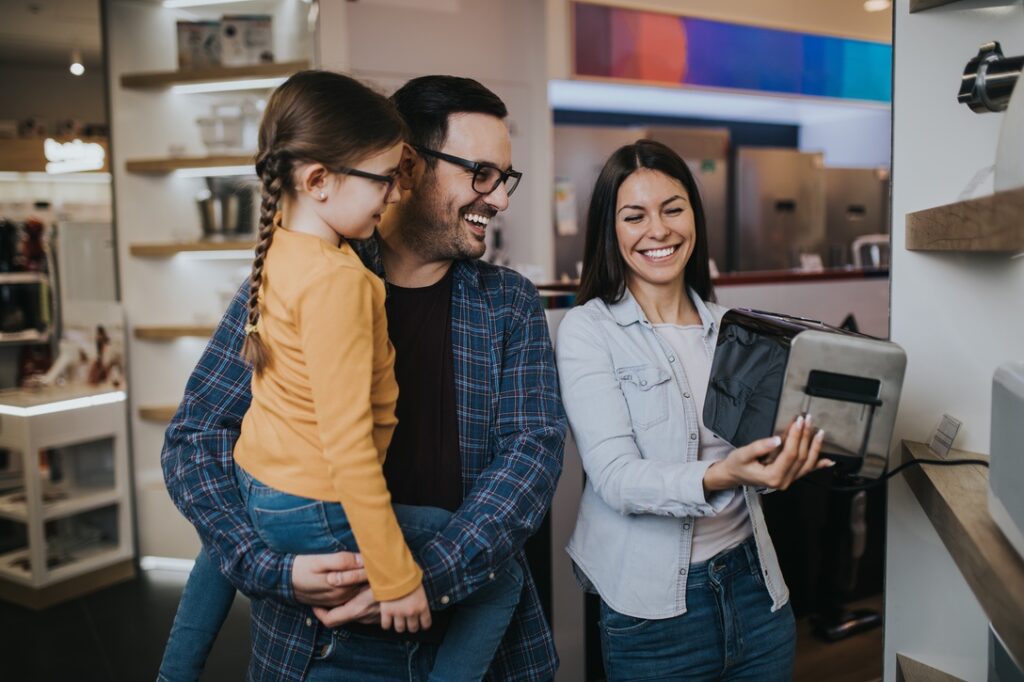 Family shopping for a toaster in a store