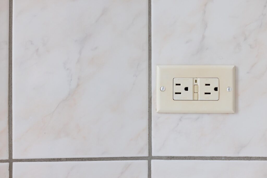 GFCI outlet installed in kitchen or bathroom of home